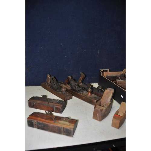 1090 - A COLLECTION OF VINTAGE WOODEN PLANES comprising two coffin planes, three jointer planes and six fil... 