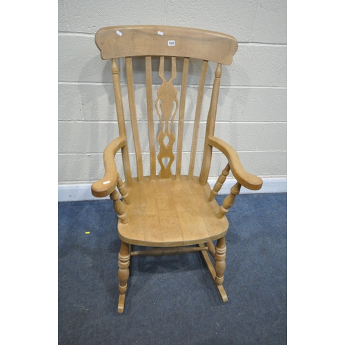 1201 - A BEECH ROCKING CHAIR, with open armrests, width 67cm x depth 84cm x height 114cm (condition - signs... 