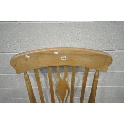 1201 - A BEECH ROCKING CHAIR, with open armrests, width 67cm x depth 84cm x height 114cm (condition - signs... 