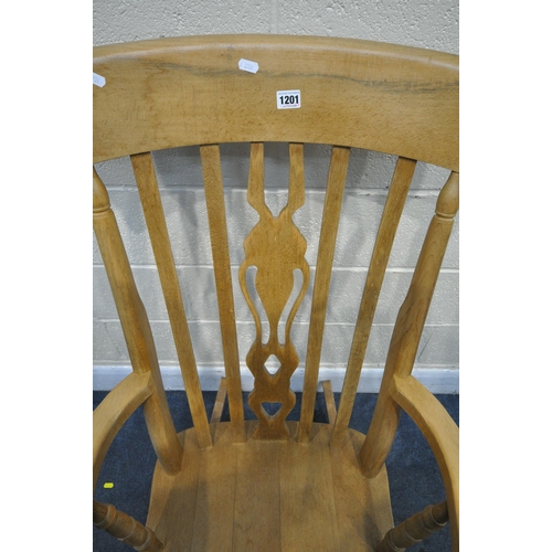 1201 - A BEECH ROCKING CHAIR, with open armrests, width 67cm x depth 84cm x height 114cm (condition - signs... 