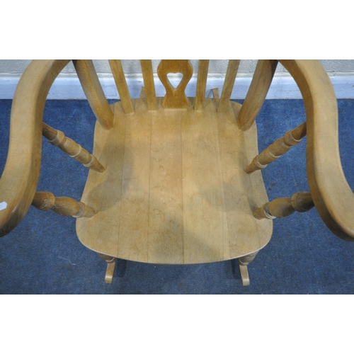 1201 - A BEECH ROCKING CHAIR, with open armrests, width 67cm x depth 84cm x height 114cm (condition - signs... 