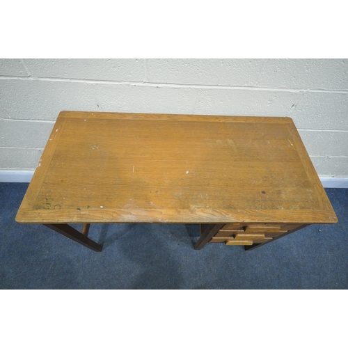 1204 - A 20TH CENTURY OAK DESK, with three drawers, and brushing slide, length 107cm x depth 51cm x height ... 