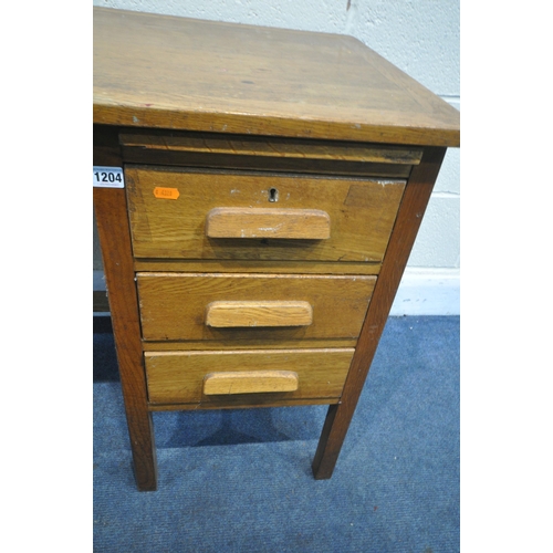 1204 - A 20TH CENTURY OAK DESK, with three drawers, and brushing slide, length 107cm x depth 51cm x height ... 