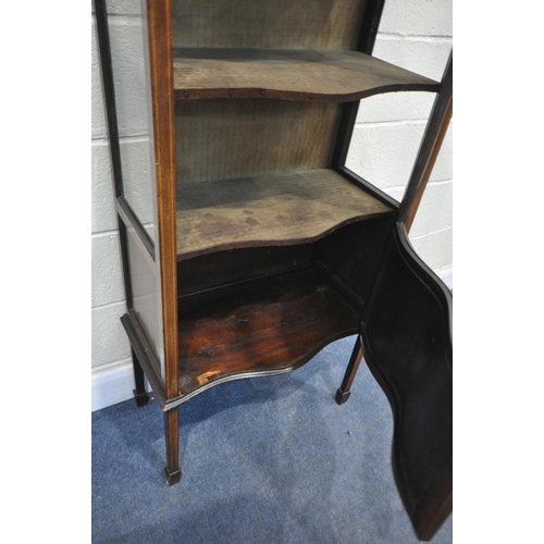 1212 - AN EDWARDIAN MAHOGANY SERPENTINE SINGLE DOOR DISPLAY CABINET, with a panel base, on square tapered l... 