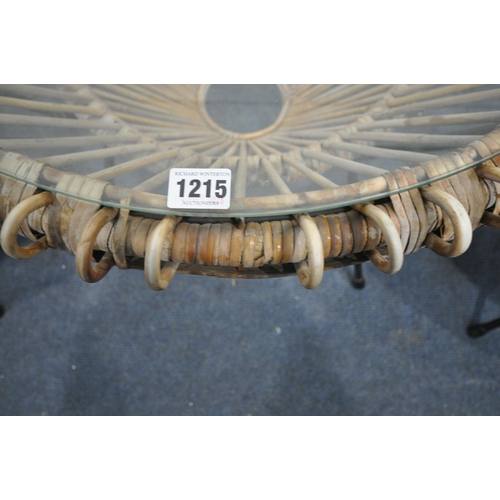 1215 - A FRANCO ALBINI CIRCULAR WICKER COFFEE TABLE, with a glass insert, diameter 69cm x height 51cm, alon... 