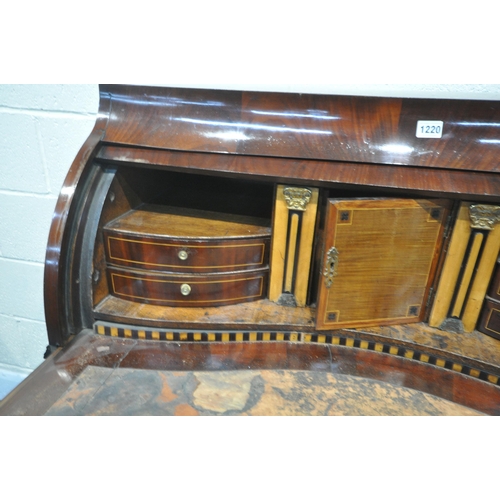 1220 - AN 18TH CENTURY CONTINENTAL MAHOGANY BARREL BUREAU, the pull out writing surface opening the barrel ... 