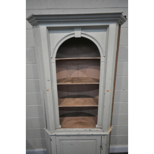 1222 - A 19TH CENTURY PAINTED PINE BARREL BACK CORNER CUPBOARD, with three open shelves, over a single fiel... 