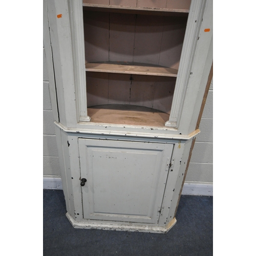 1222 - A 19TH CENTURY PAINTED PINE BARREL BACK CORNER CUPBOARD, with three open shelves, over a single fiel... 