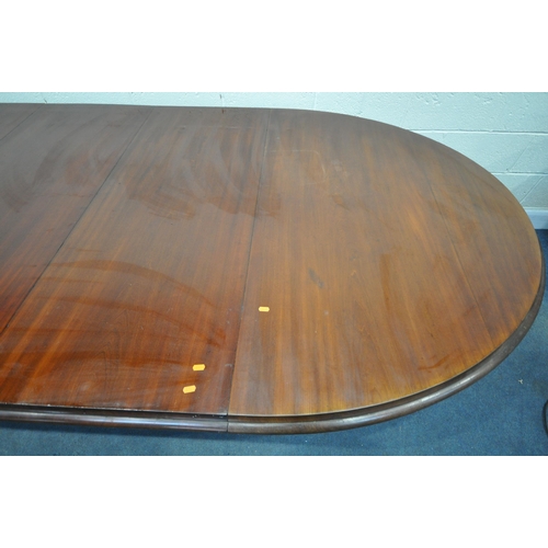 1223 - A VICTORIAN WALNUT WIND OUT DINING TABLE, with rounded ends, three additional leaves, on bulbous leg... 