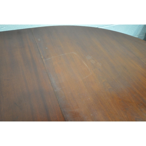 1223 - A VICTORIAN WALNUT WIND OUT DINING TABLE, with rounded ends, three additional leaves, on bulbous leg... 