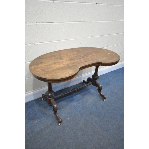 1225 - A LATE VICTORIAN WALNUT KIDNEY TABLE, on turned supports, and stretchers, length 121cm x depth 65cm ... 