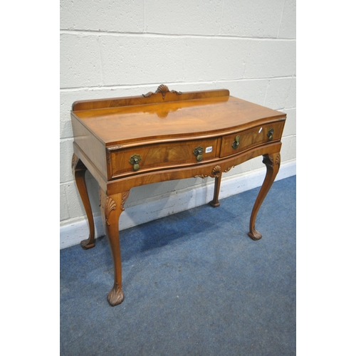 1230 - A QUEEN ANNE STYLE WALNUT SERPENTINE SIDE TABLE, with a raised back, two drawers, on cabriole front ... 