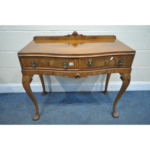 1230 - A QUEEN ANNE STYLE WALNUT SERPENTINE SIDE TABLE, with a raised back, two drawers, on cabriole front ... 