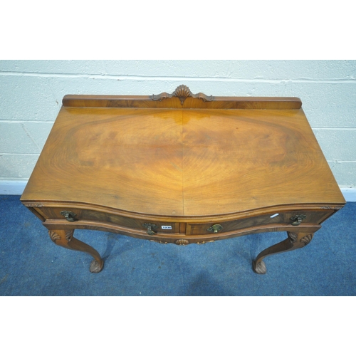 1230 - A QUEEN ANNE STYLE WALNUT SERPENTINE SIDE TABLE, with a raised back, two drawers, on cabriole front ... 