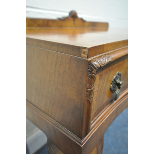 1230 - A QUEEN ANNE STYLE WALNUT SERPENTINE SIDE TABLE, with a raised back, two drawers, on cabriole front ... 