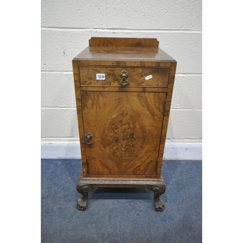 1236 - AN EARLY 20TH CENTURY QUEEN ANNE STYLE WALNUT BEDSIDE CABINET, with a raised back, single drawer and... 