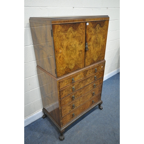 1237 - AN EARLY 20TH CENTURY QUEEN ANNE STYLE WALNUT LINEN CUPBOARD, the double cupboard doors that's enclo... 