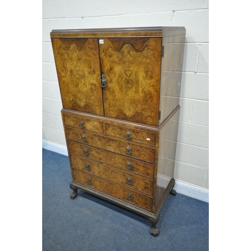 1237 - AN EARLY 20TH CENTURY QUEEN ANNE STYLE WALNUT LINEN CUPBOARD, the double cupboard doors that's enclo... 