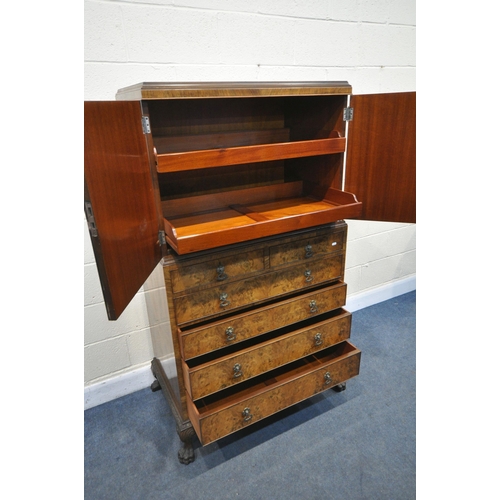 1237 - AN EARLY 20TH CENTURY QUEEN ANNE STYLE WALNUT LINEN CUPBOARD, the double cupboard doors that's enclo... 