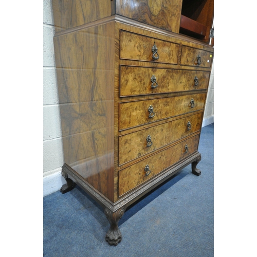 1237 - AN EARLY 20TH CENTURY QUEEN ANNE STYLE WALNUT LINEN CUPBOARD, the double cupboard doors that's enclo... 