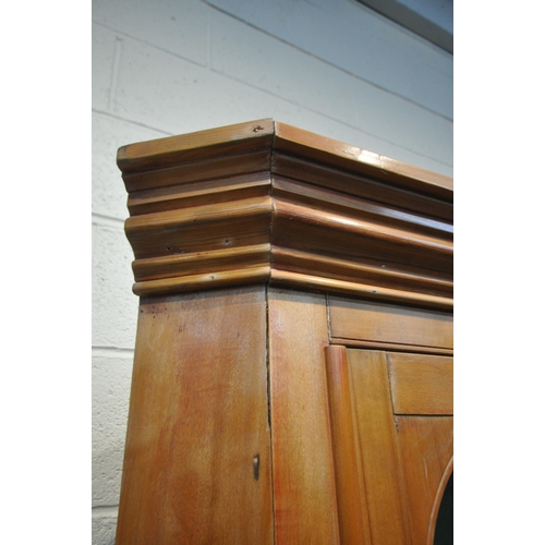 1239 - A 19TH CENTURY SATINWOOD GLAZED SINGLE DOOR CORNER CUPBOARD, enclosing two shelves, over a panelled ... 