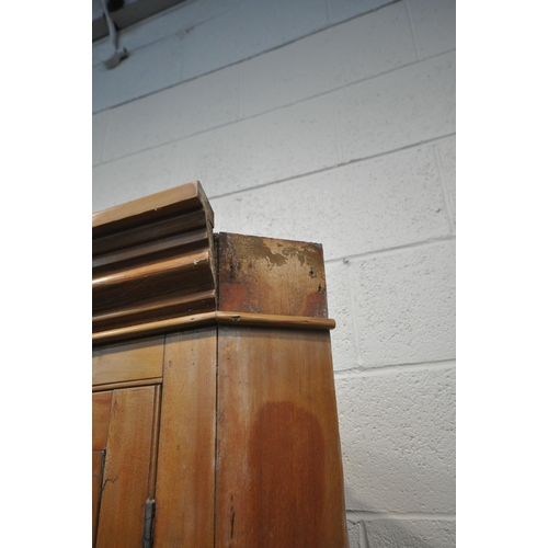 1239 - A 19TH CENTURY SATINWOOD GLAZED SINGLE DOOR CORNER CUPBOARD, enclosing two shelves, over a panelled ... 