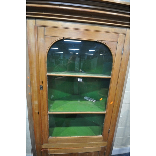 1239 - A 19TH CENTURY SATINWOOD GLAZED SINGLE DOOR CORNER CUPBOARD, enclosing two shelves, over a panelled ... 