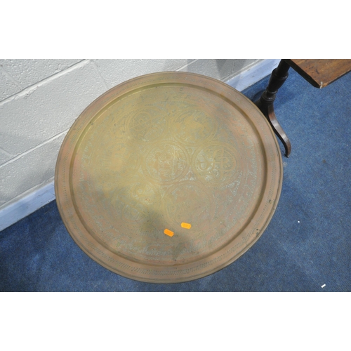 1255 - AN ANGLO INDIAN FOLDING TRAY TABLE, with a circular brass tray, diameter 64cm x height 57cm, the fol... 