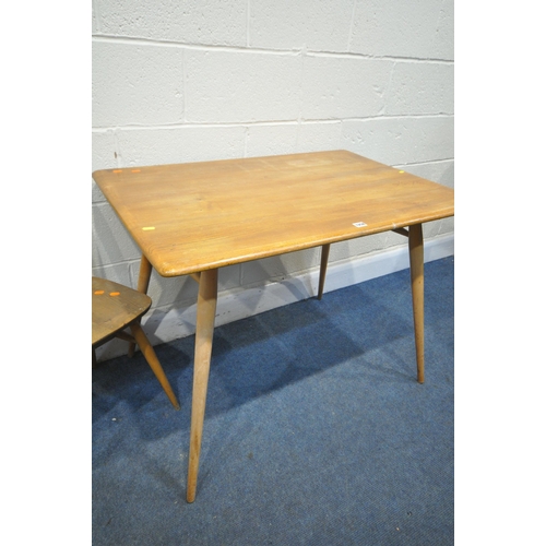 1258 - AN ERCOL BLONDE ELM MODEL 393 RECTANGULAR DINING TABLE, with a spindled undershelf, on cylindrical l... 