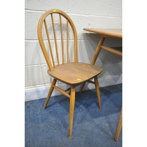 1258 - AN ERCOL BLONDE ELM MODEL 393 RECTANGULAR DINING TABLE, with a spindled undershelf, on cylindrical l... 