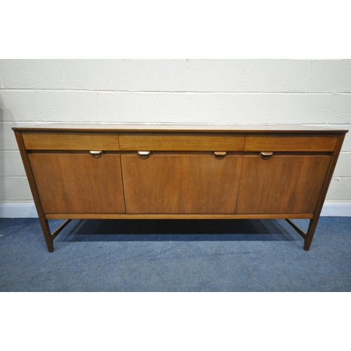 1266 - A MID CENTURY NATHAN SIDEBOARD, with three drawers, over cupboard doors flanking a fall front doors,... 