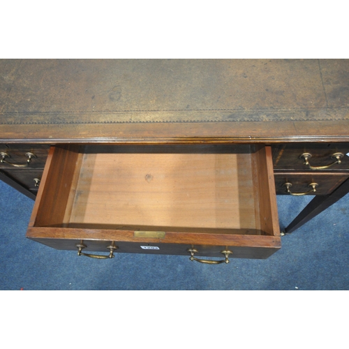 1293 - AN EDWARDIAN MAHOGANY DESK, with a green leather writing surface, five drawers, on square tapered le... 