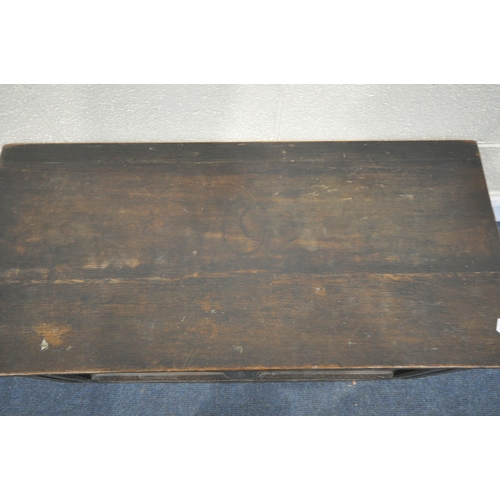 1295 - A GEORGIAN CARVED OAK PANEL COFFER, width 98cm x depth 46cm x height 43cm (condition:-feet cut down,... 