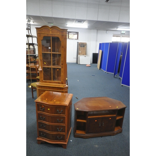 1307 - FOUR YEWWOOD FURNITURE PIECES, to include a small chest of four drawers, corner cupboard, tv stand a... 