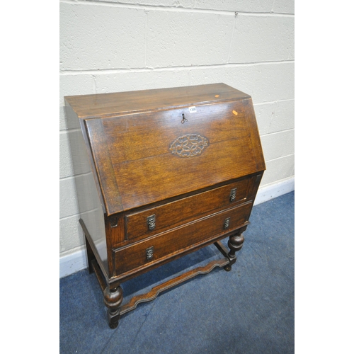 1308 - AN EARLY 20TH CENTURY OAK BUREAU, with two drawers, width 75cm x depth 41cm x height 100cm (conditio... 