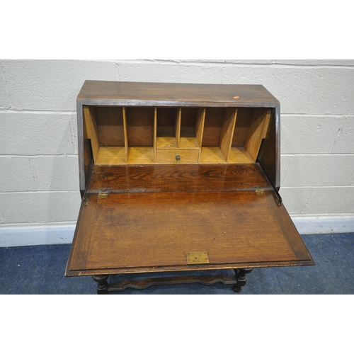 1308 - AN EARLY 20TH CENTURY OAK BUREAU, with two drawers, width 75cm x depth 41cm x height 100cm (conditio... 