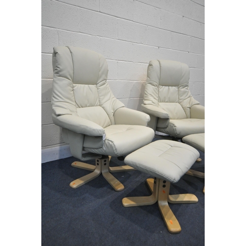 1315 - A PAIR OF CREAM LEATHER STRESSLESS STYLE SWIVEL RECLINING CHAIRS, on beech legs, and matching stools... 