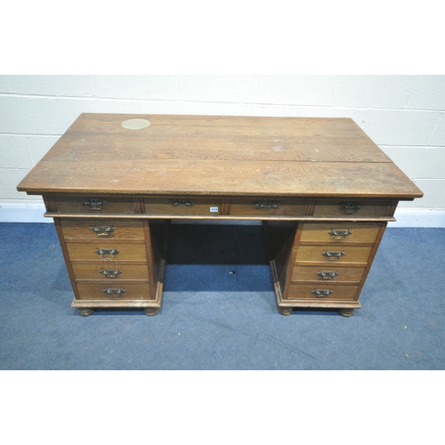 1316 - AN EARLY 20TH CENTURY OAK PEDESTAL DESK, with four frieze drawers, and four drawers to each pedestal... 