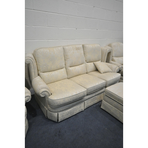 1320 - A FLORAL AND GOLD UPHOLSTERED FOUR PIECE LOUNGE SUITE, comprising a three seater sofa, length 206cm,... 