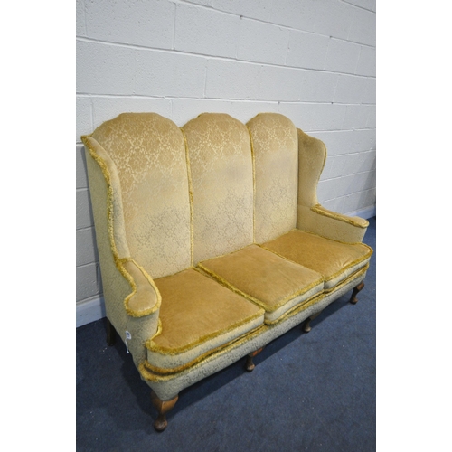 1322 - A GEORGIAN STYLE HIGH WING BACK SOFA, gold fabric, flat outswept arms, on four cabriole legs, length... 