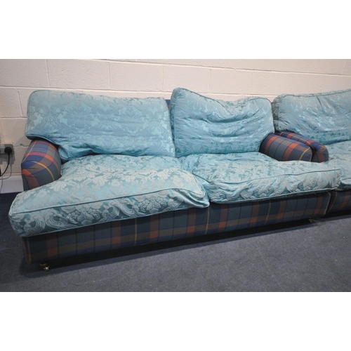 1324 - A PAIR OF HOWARD AND SONS STYLE SOFA, having tartan fabric and later blue cushions, on turned legs, ... 