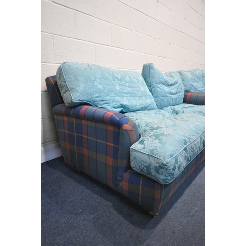 1324 - A PAIR OF HOWARD AND SONS STYLE SOFA, having tartan fabric and later blue cushions, on turned legs, ... 