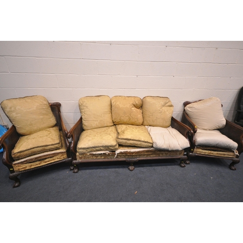 1325 - AN EARLY 20TH CENTURY MAHOGANY BERGERE FRAMED SUITE, comprising a settee, length 175cm, and a pair o... 