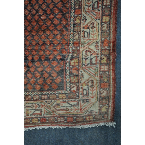 1330 - A 20TH CENTURY IRANIAN RED PATTERNED CARPET RUNNER, 319cm x105cm (condition:-some low pile)