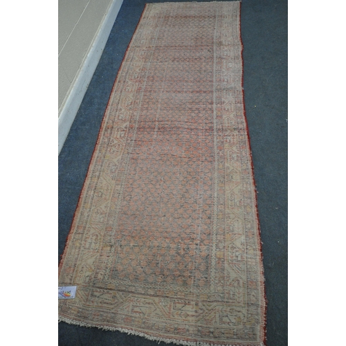 1330 - A 20TH CENTURY IRANIAN RED PATTERNED CARPET RUNNER, 319cm x105cm (condition:-some low pile)