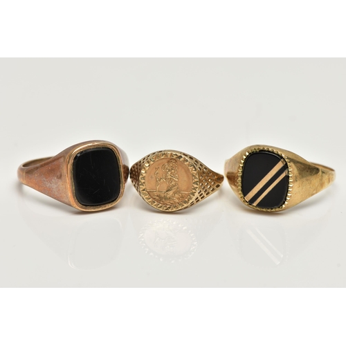 22 - THREE SIGNET RINGS, to include a polished onyx inlay signet ring, collet set in a yellow metal mount... 