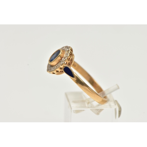 23 - A 14CT GOLD, SAPPHIRE AND DIAMOND CLUSTER RING, of an oval form, centrally set with an oval cut mid ... 