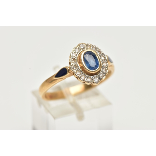 23 - A 14CT GOLD, SAPPHIRE AND DIAMOND CLUSTER RING, of an oval form, centrally set with an oval cut mid ... 