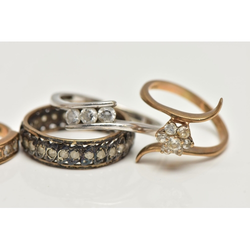 27 - FIVE ASSORTED RINGS, the first a 9ct yellow gold ring, set with a floral cluster of circular cut cub... 