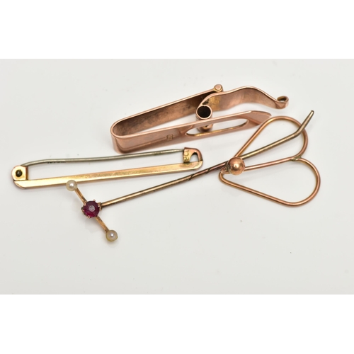 32 - A STICK PIN AND THREE TIE PINS, the stick pin set with a single circular cut ruby flanked with two s... 